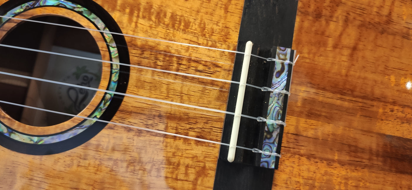 Restringing service charge - per string